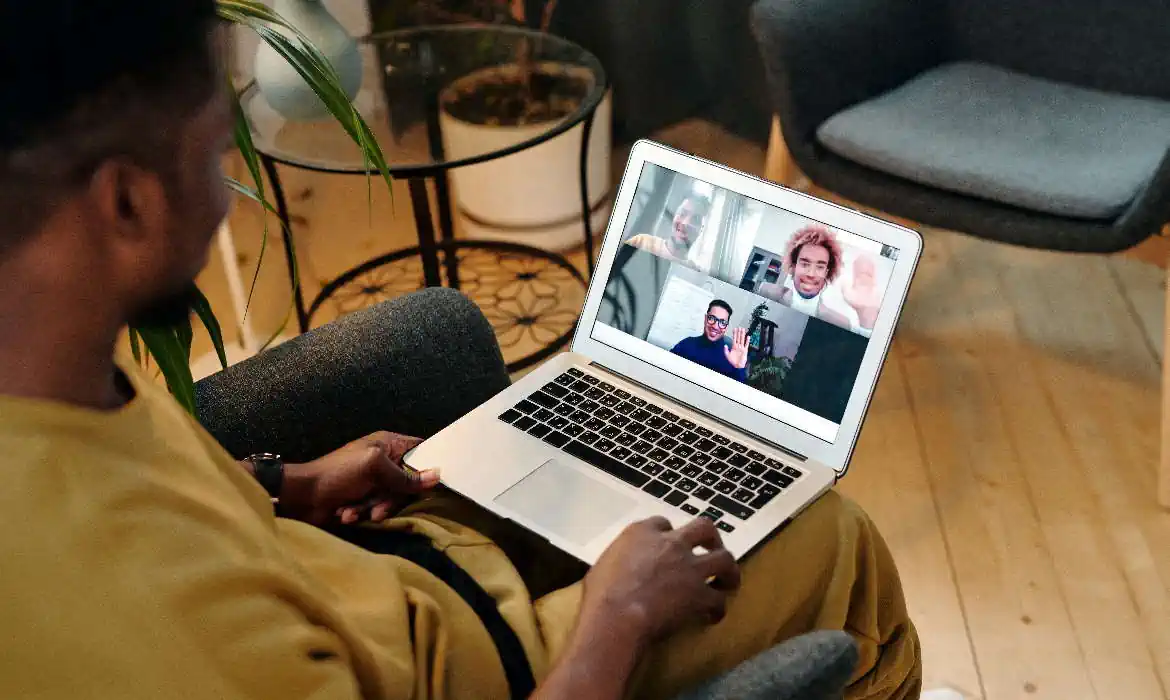 A user using a laptop to join a meeting
